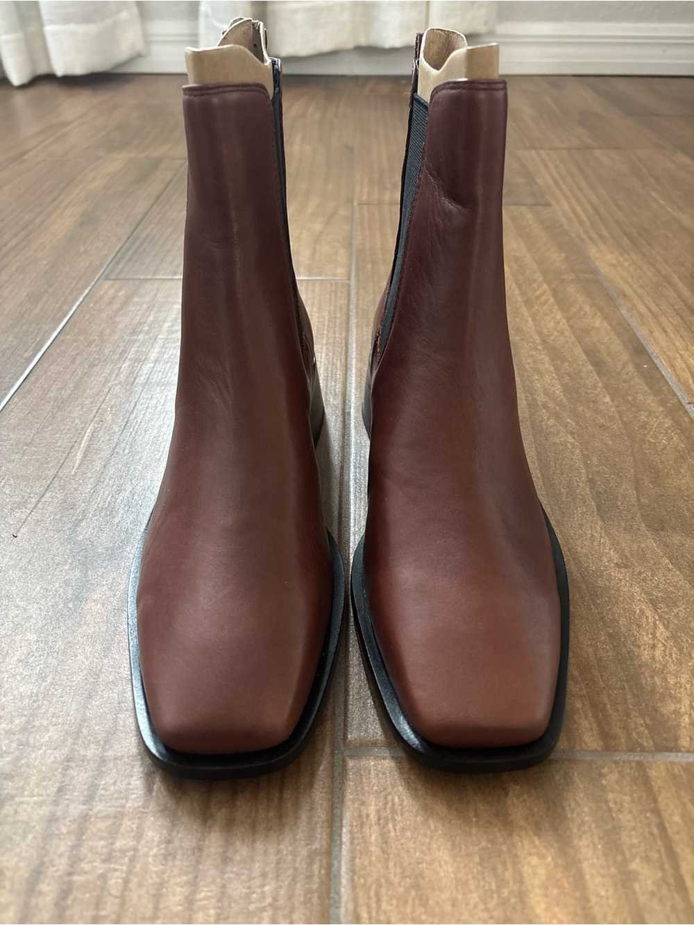 Sam Edelman Thelma Chelsea boots feature a sleek, modern square toe.